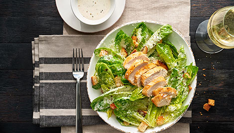 Salad Bowls served in a table with salad in it