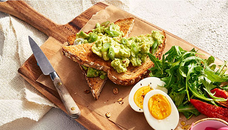 Top Handle Serving Board with food on it